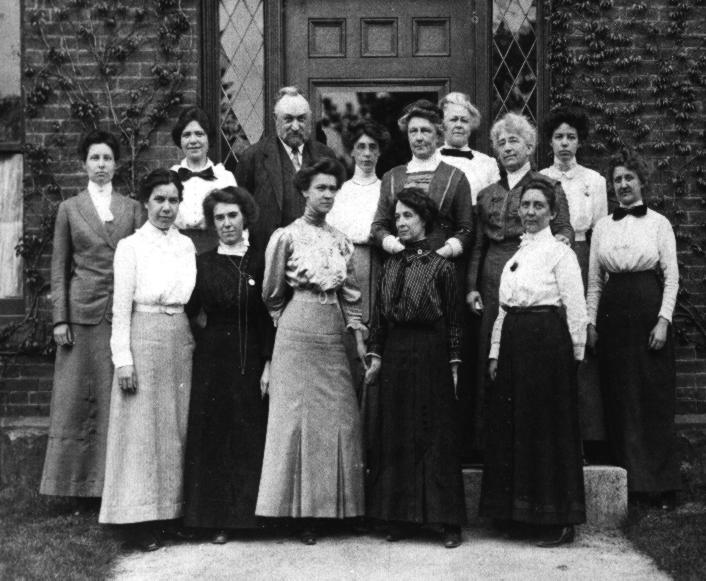 Edward Charles Pickering and his Computers standing in front of Building C at the Harvard College Observatory, 13 May 1913.