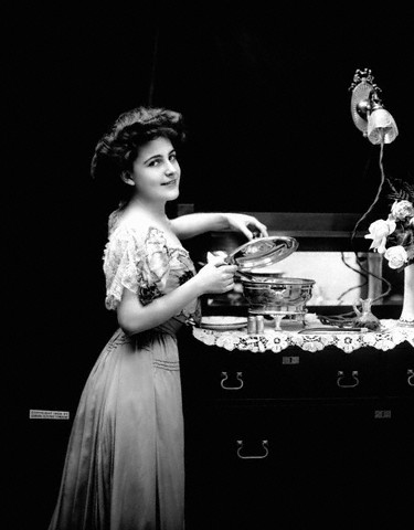 Young Woman with Electric Cookpot